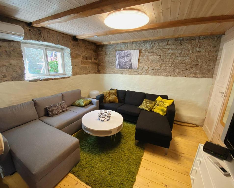 a living room with a couch and a table at Tehnika 7 street apartments in Tallinn