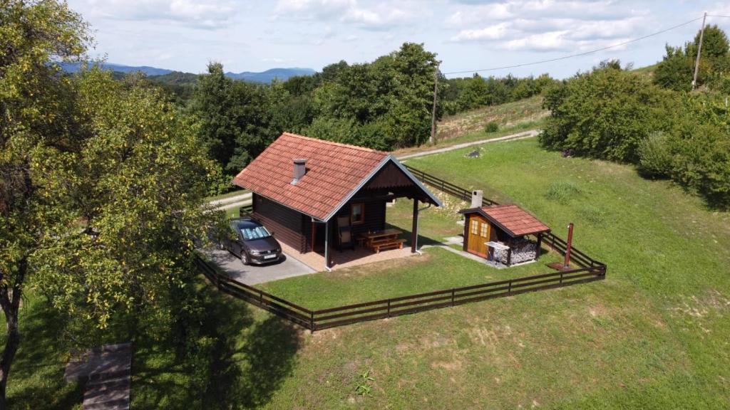 an overhead view of a small house in a field at Robinzonski smještaj Green Peak in Tuhelj