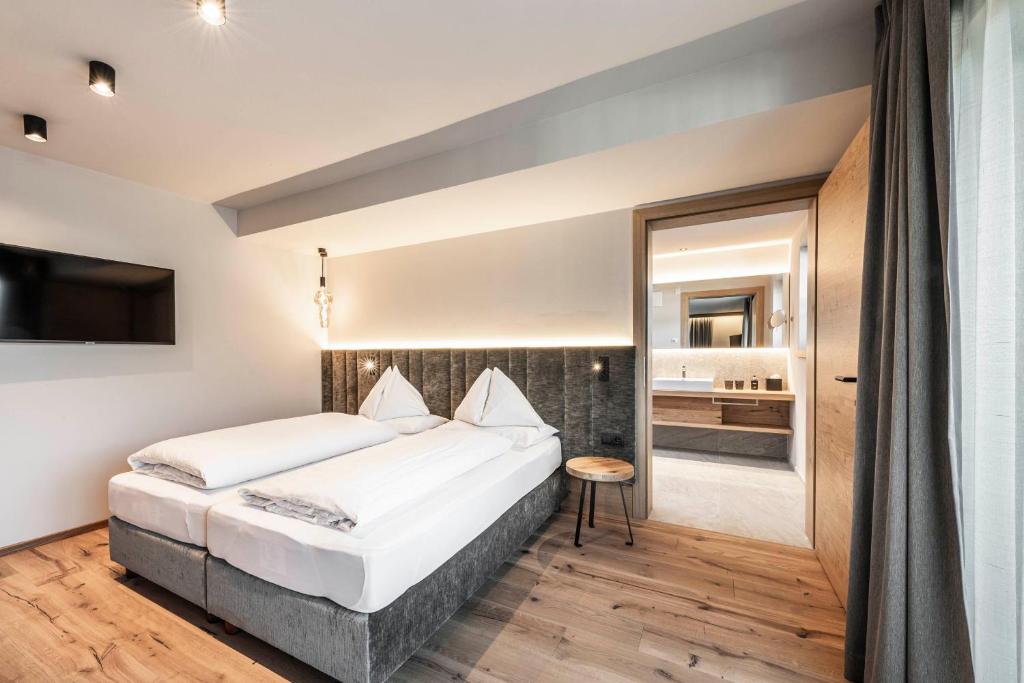 Postel nebo postele na pokoji v ubytování Hotel Olympia