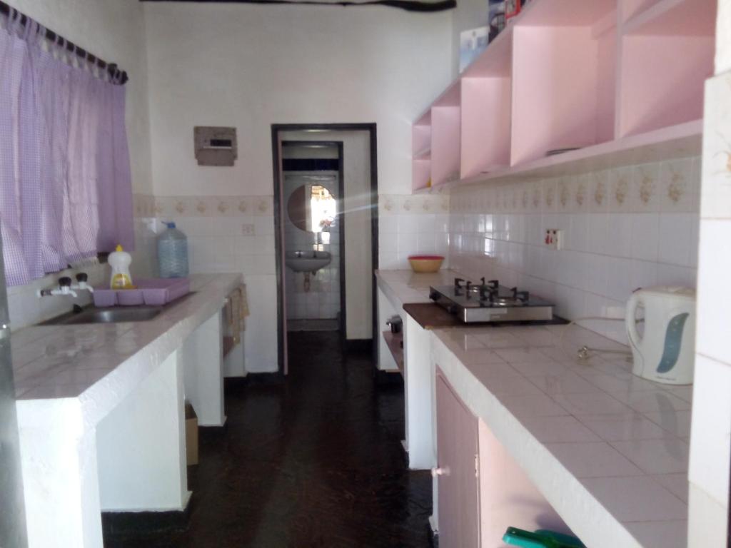 Kuchyň nebo kuchyňský kout v ubytování Glory Ocean Villas - Diani