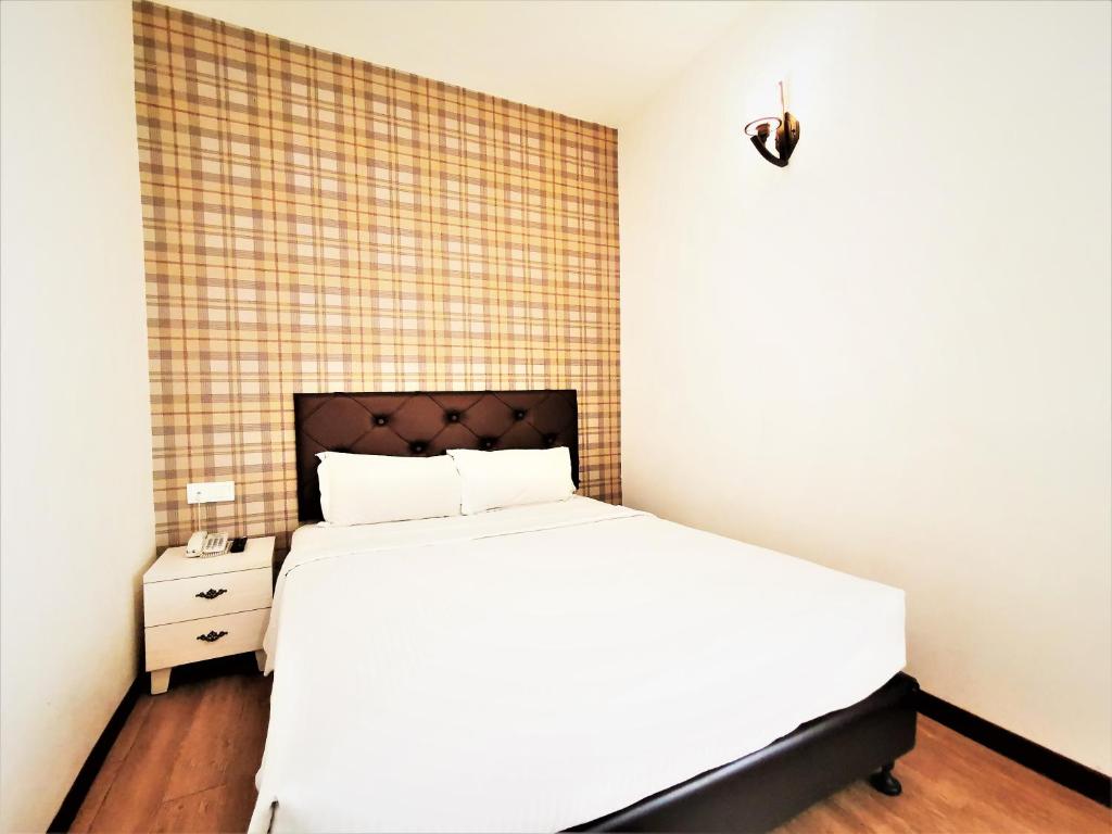 Postel nebo postele na pokoji v ubytování Koho Hotel - Johor Bahru