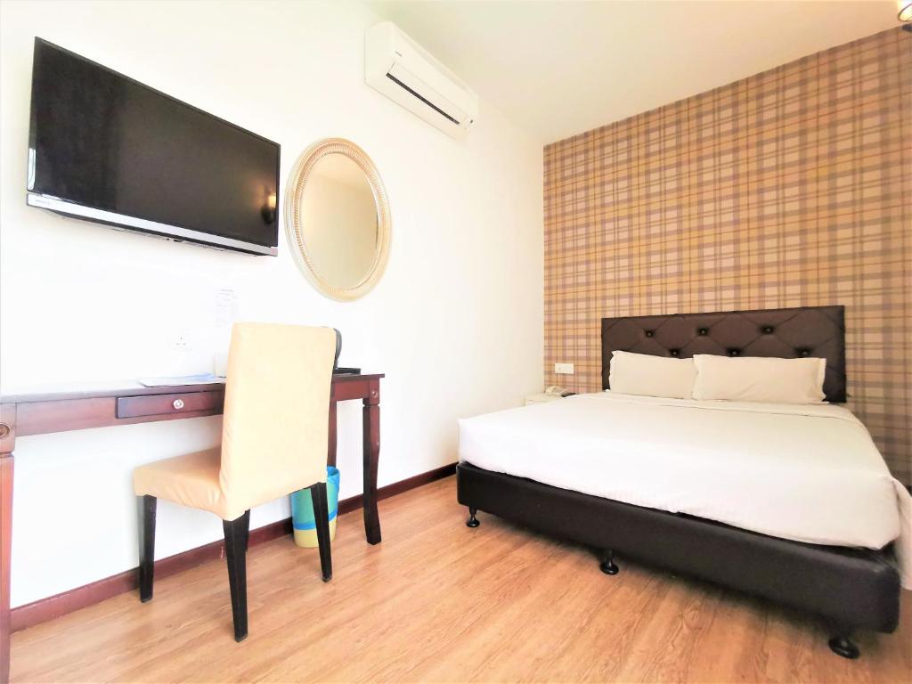 Postel nebo postele na pokoji v ubytování Koho Hotel - Johor Bahru