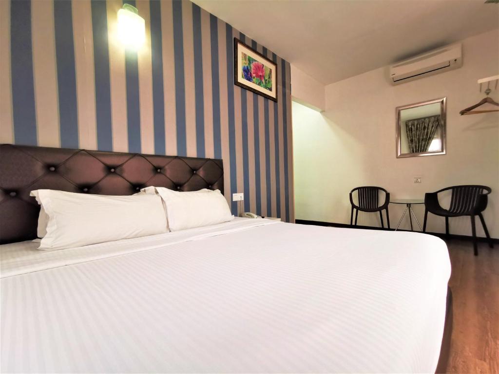 Postel nebo postele na pokoji v ubytování Koho Hotel - Johor Bahru