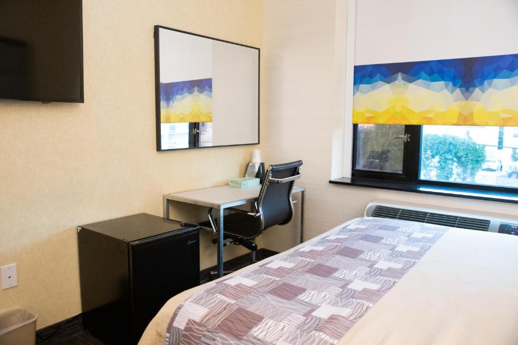 Postel nebo postele na pokoji v ubytování 7 Days Hotel