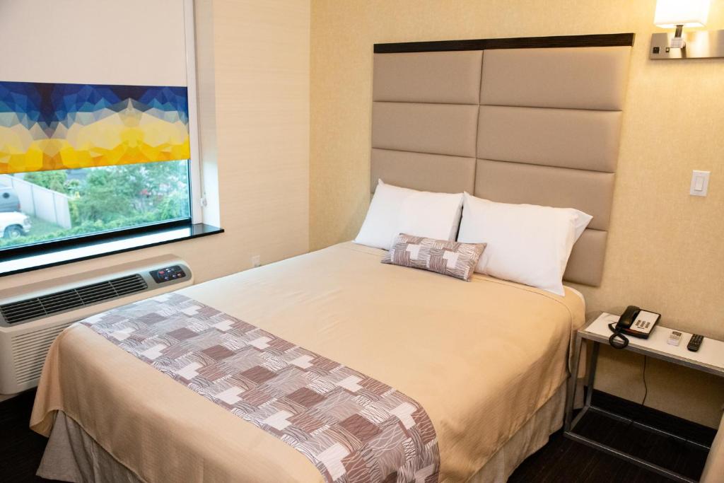 Postel nebo postele na pokoji v ubytování 7 Days Hotel