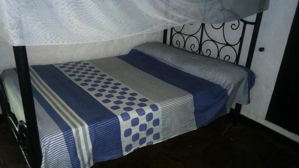 Postel nebo postele na pokoji v ubytování Glory Ocean Villas - Diani