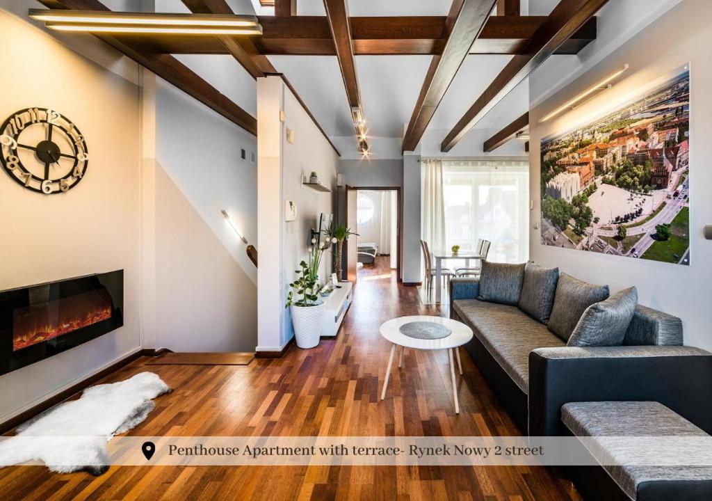 a living room filled with furniture and a fireplace at 5-stars Apartments - Old Town in Szczecin