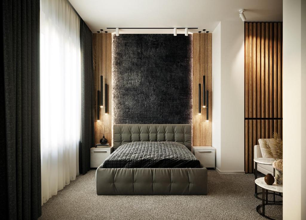 a bedroom with a bed and a large window at Privilege Suites by Central Park in Belgrade