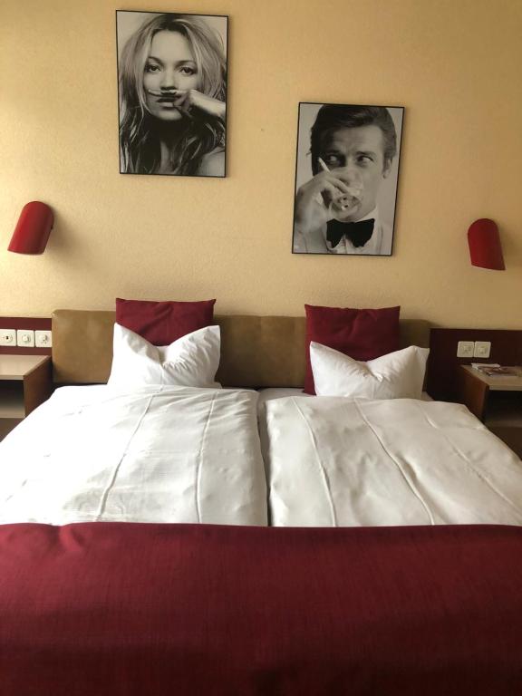 Postel nebo postele na pokoji v ubytování Hotel Casino