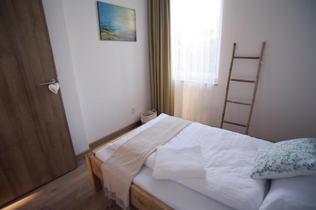 A bed or beds in a room at Art Gallery Apartment