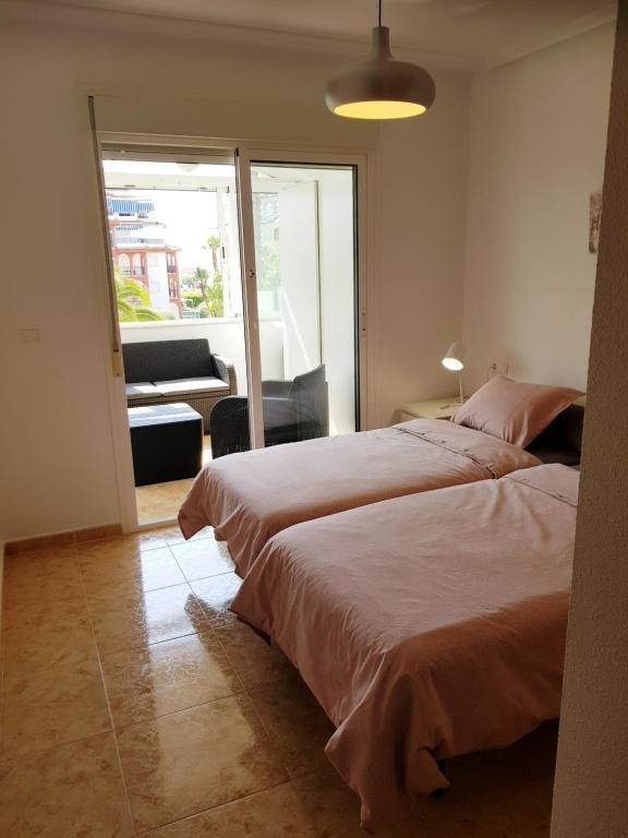 Posteľ alebo postele v izbe v ubytovaní Appartement Torre La Mata