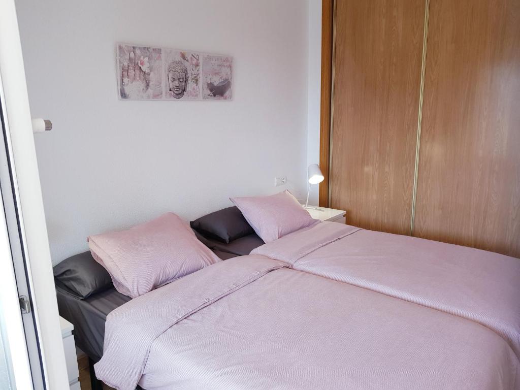 Posteľ alebo postele v izbe v ubytovaní Appartement Torre La Mata