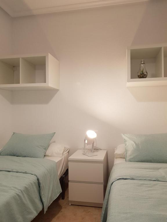 Posteľ alebo postele v izbe v ubytovaní Appartement Torre La Mata