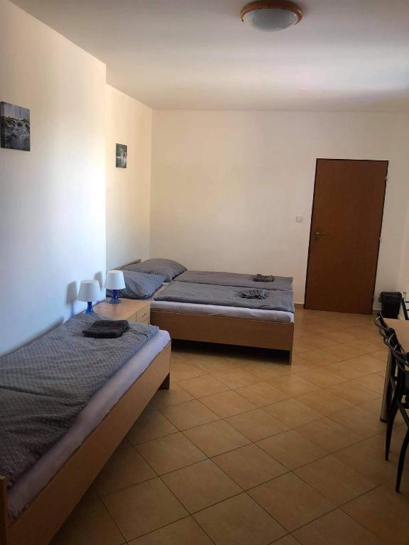 Postel nebo postele na pokoji v ubytování Penzion Adamčík