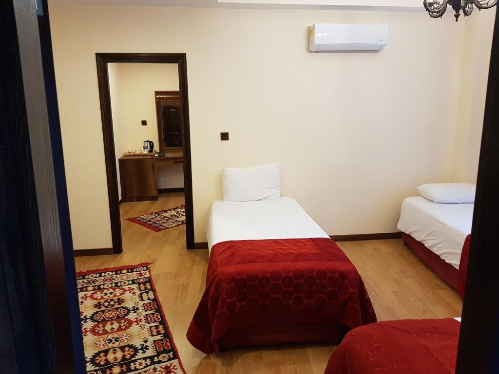 Postel nebo postele na pokoji v ubytování Kervansaray Canakkale Hotel - Special Category