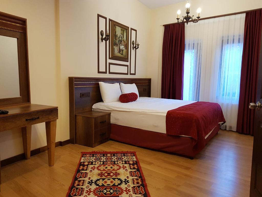 Postel nebo postele na pokoji v ubytování Kervansaray Canakkale Hotel - Special Category