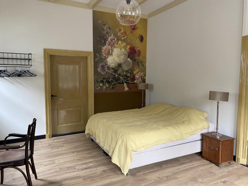Postel nebo postele na pokoji v ubytování Bed & Breakfast Bloemen Vertellen