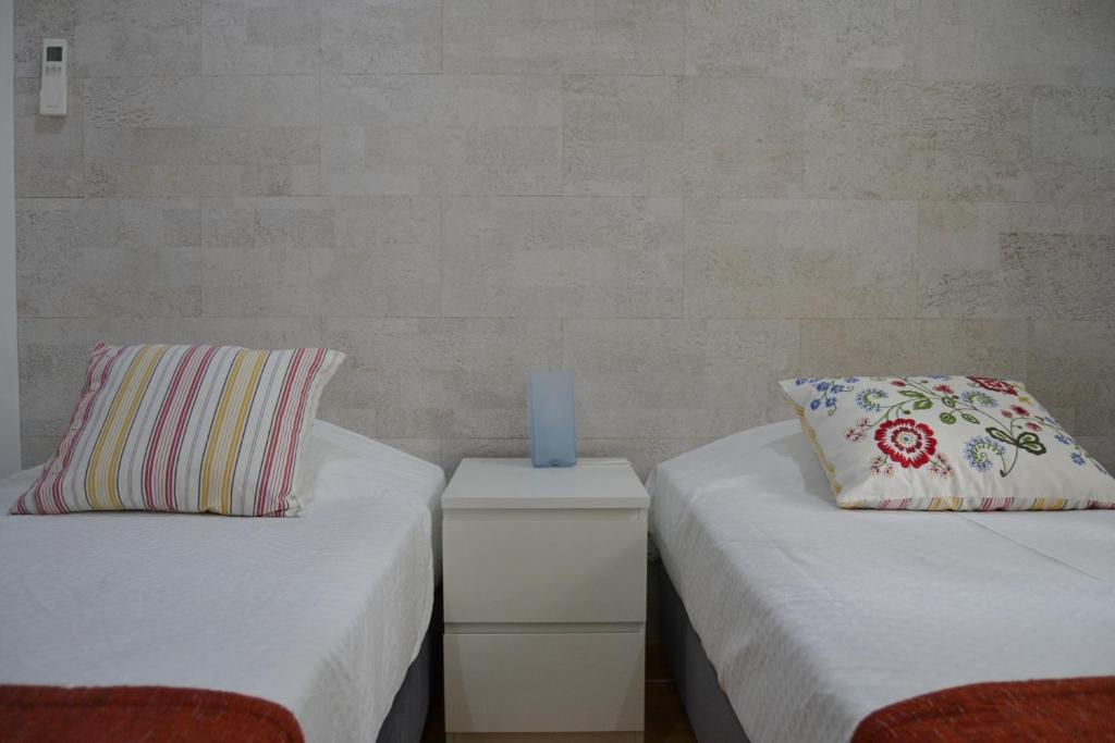 Een bed of bedden in een kamer bij Cerca da Vitoria 2 Sesimbra