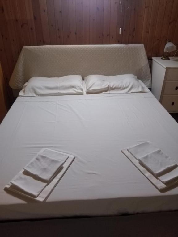 Postel nebo postele na pokoji v ubytování Appartamento Azalea