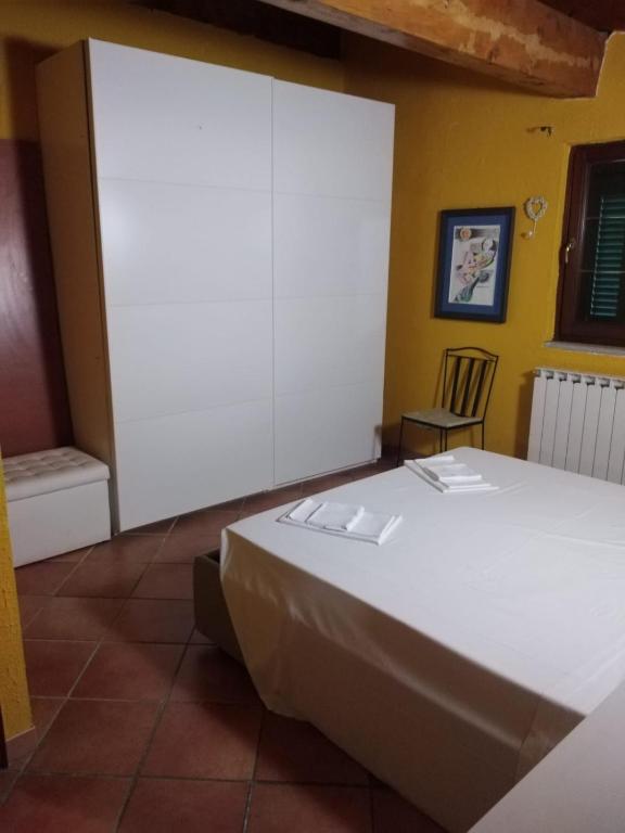 Postel nebo postele na pokoji v ubytování Appartamento Azalea