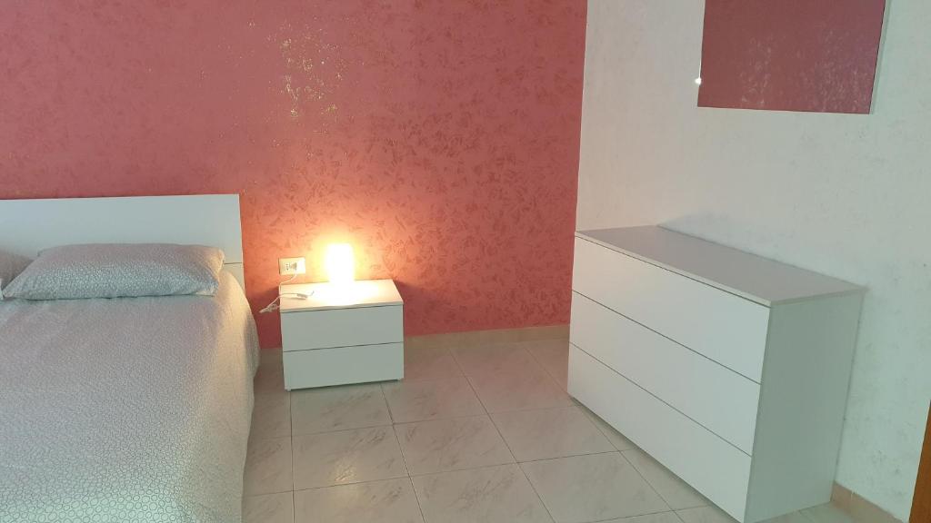 A bed or beds in a room at Appartamento In Paese