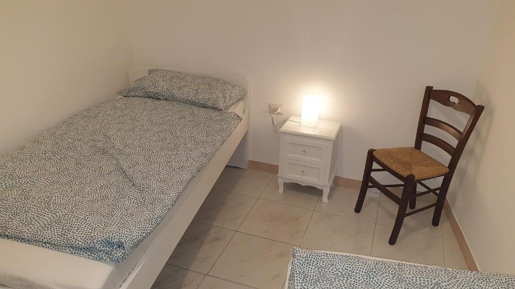 A bed or beds in a room at Appartamento In Paese