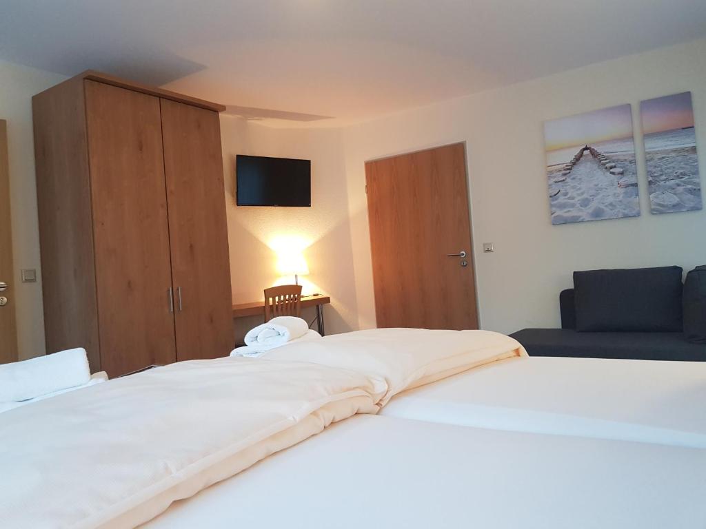 Postel nebo postele na pokoji v ubytování Hotel Penterknapp