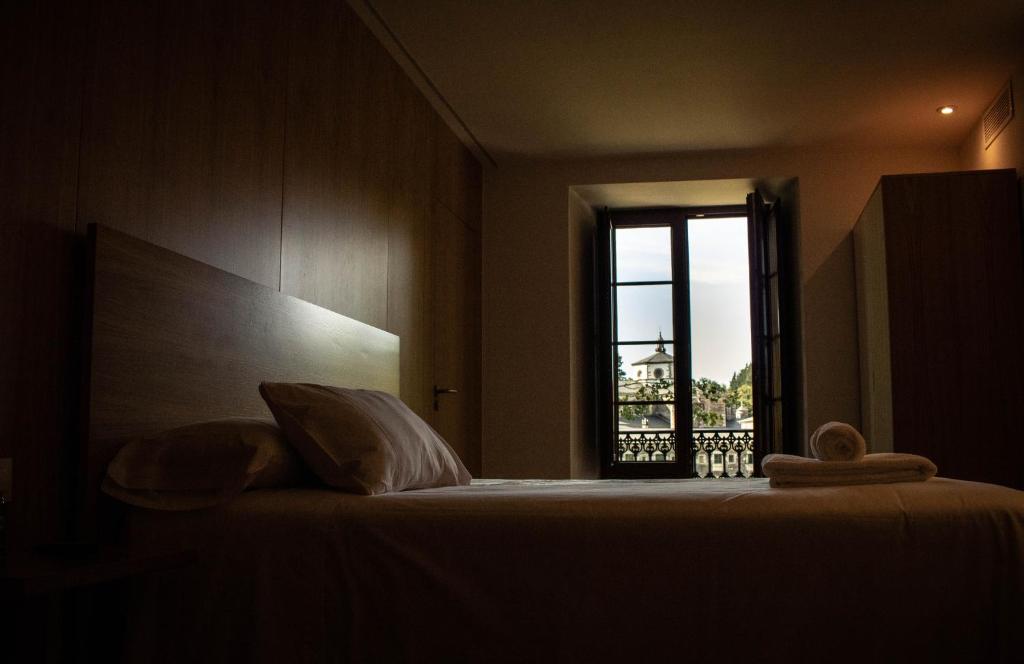 Postel nebo postele na pokoji v ubytování A Casa da Botica