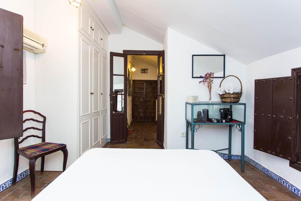 Postel nebo postele na pokoji v ubytování Casa del siglo XVII