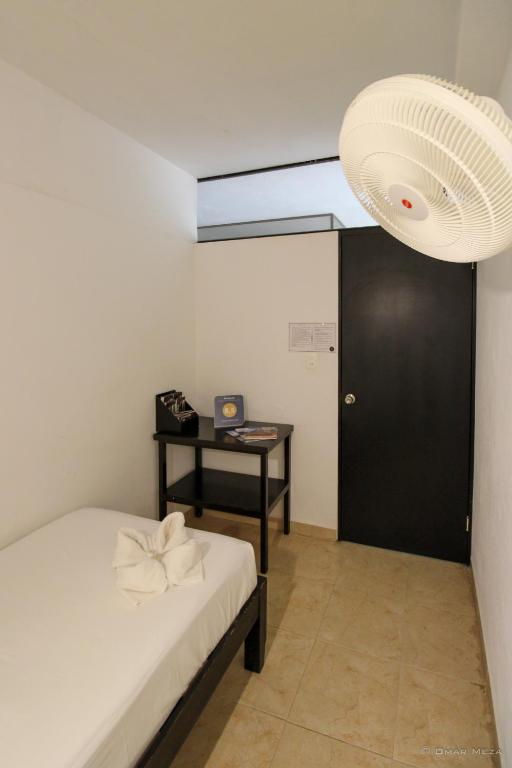 Postel nebo postele na pokoji v ubytování Hostal Gayser