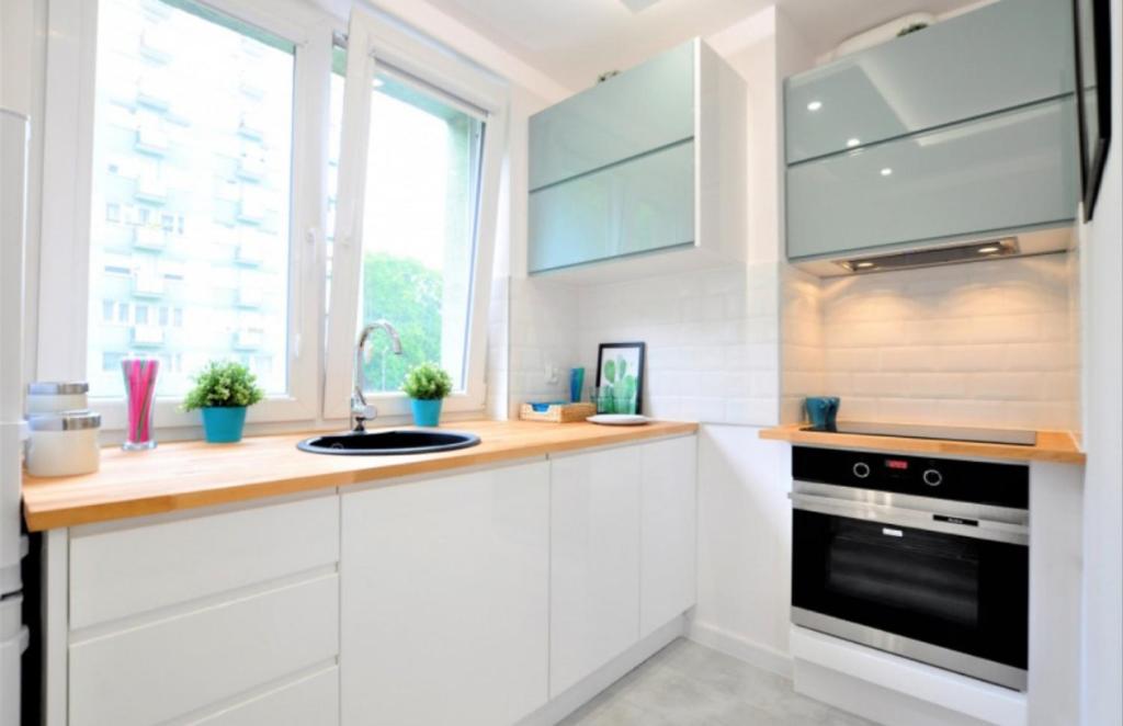 Kuchyňa alebo kuchynka v ubytovaní APARTAMENT GDAŃSK ŚRÓDMIEŚCIE