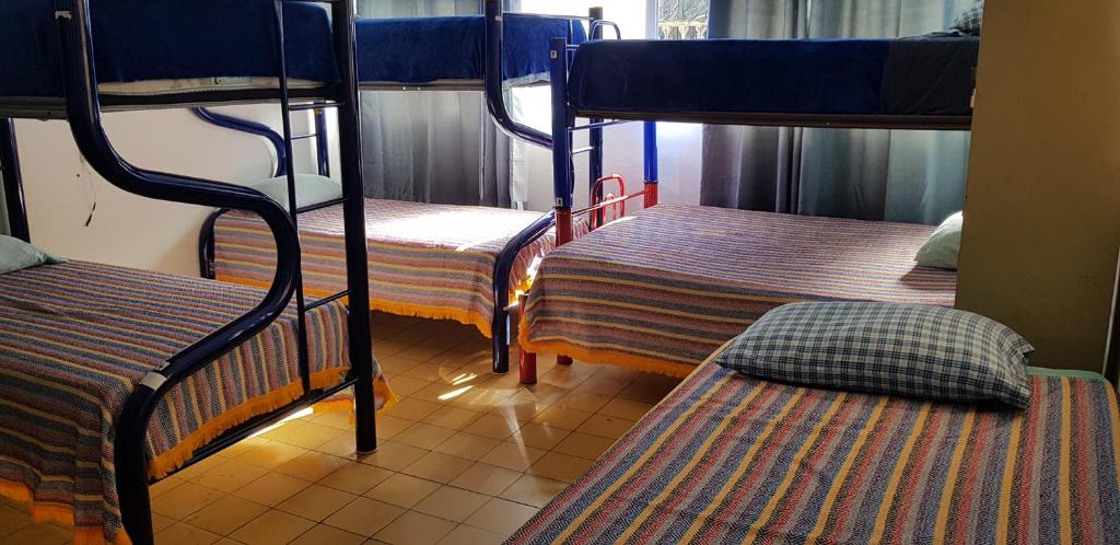 Postel nebo postele na pokoji v ubytování Hostel Vallarta