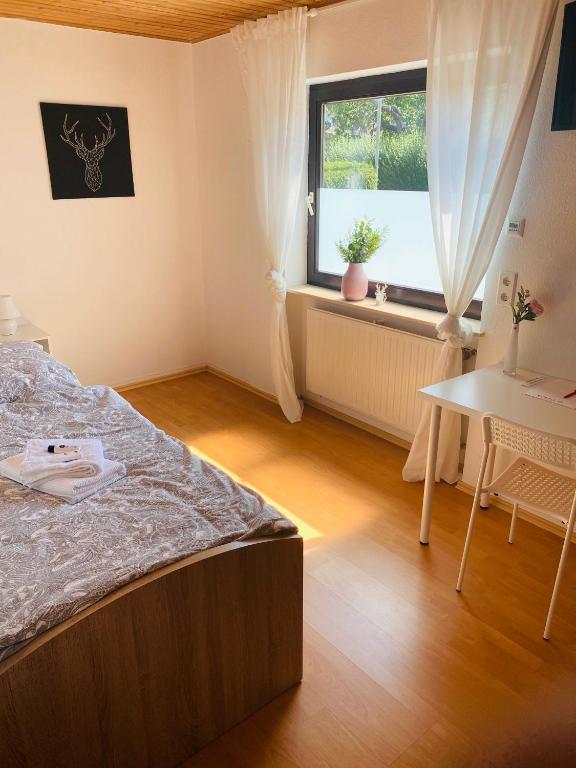 Postel nebo postele na pokoji v ubytování Pension Platzhirsch