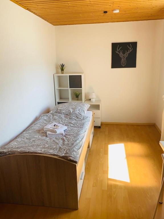 Postel nebo postele na pokoji v ubytování Pension Platzhirsch
