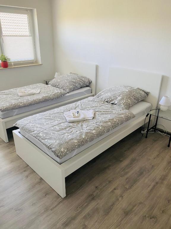 Postel nebo postele na pokoji v ubytování Pension Platzhirsch