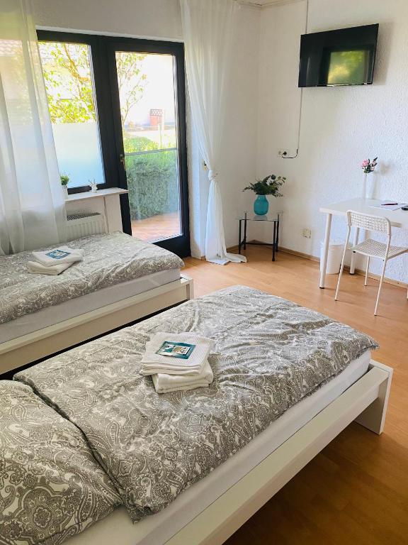Postel nebo postele na pokoji v ubytování Pension Platzhirsch