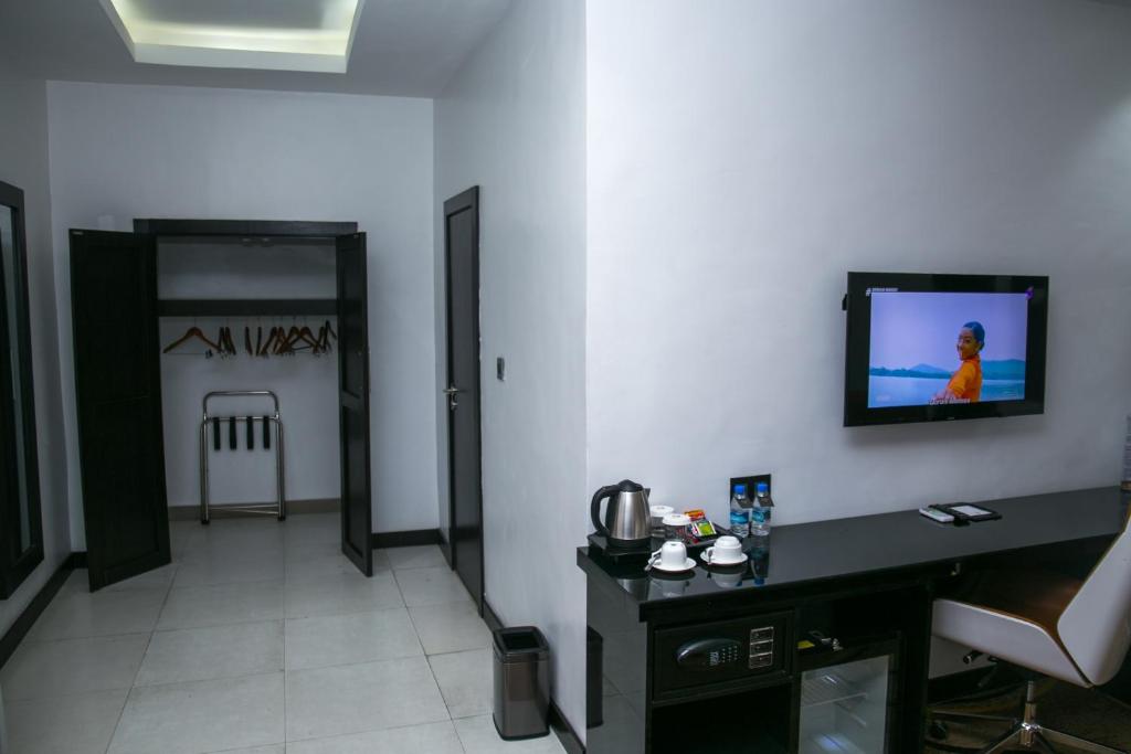 TV a/nebo společenská místnost v ubytování GreenPoint Hotel