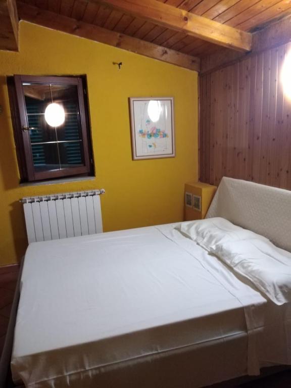 Postel nebo postele na pokoji v ubytování Appartamento Azalea