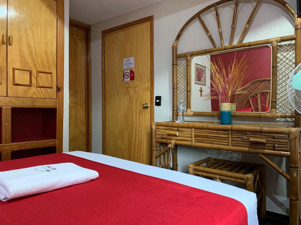 Postel nebo postele na pokoji v ubytování Hotel Alameda