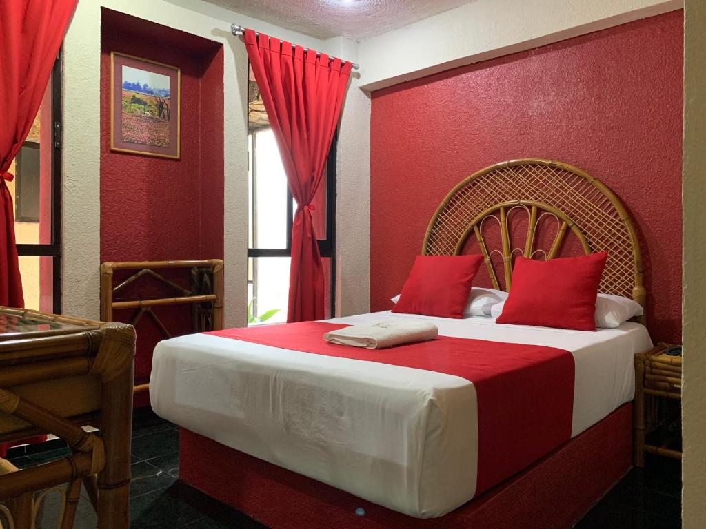 Postel nebo postele na pokoji v ubytování Hotel Alameda
