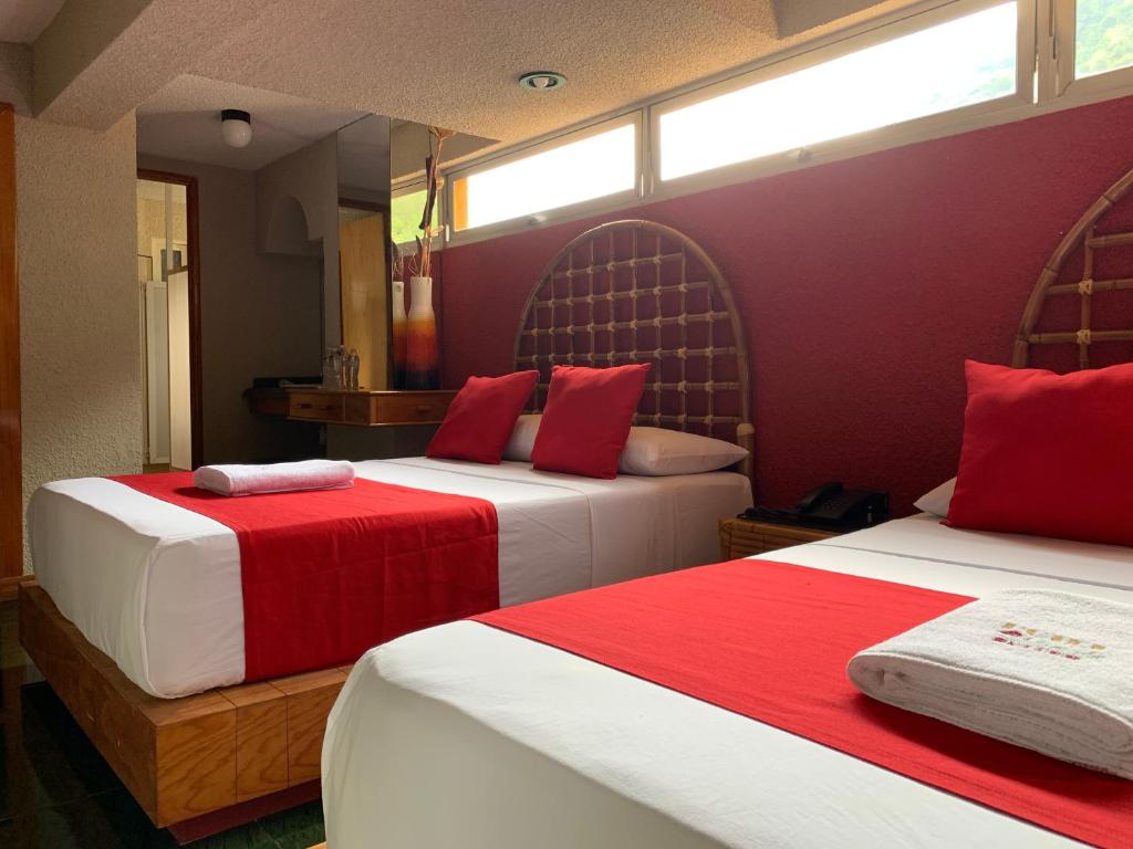 Postel nebo postele na pokoji v ubytování Hotel Alameda
