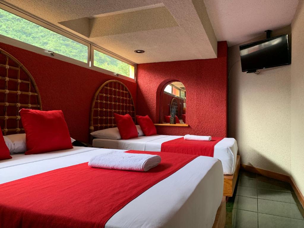 Postel nebo postele na pokoji v ubytování Hotel Alameda