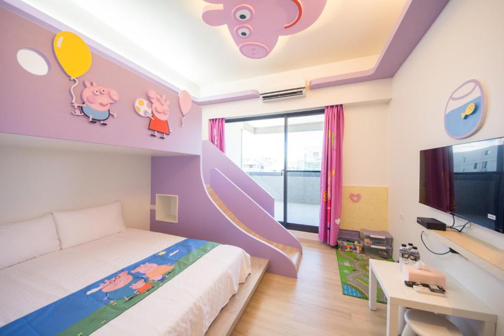 Postel nebo postele na pokoji v ubytování Kids Paradise
