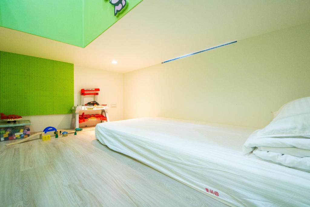 Postel nebo postele na pokoji v ubytování Kids Paradise