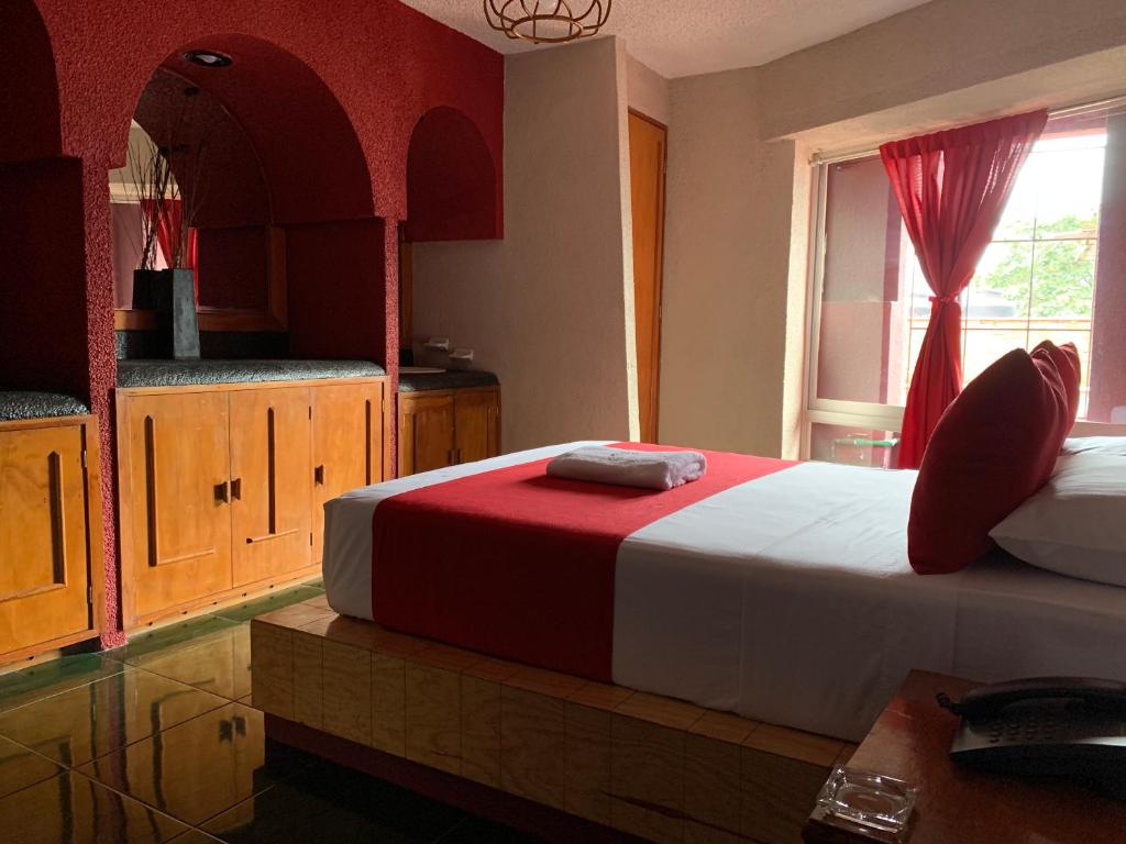 Postel nebo postele na pokoji v ubytování Hotel Alameda