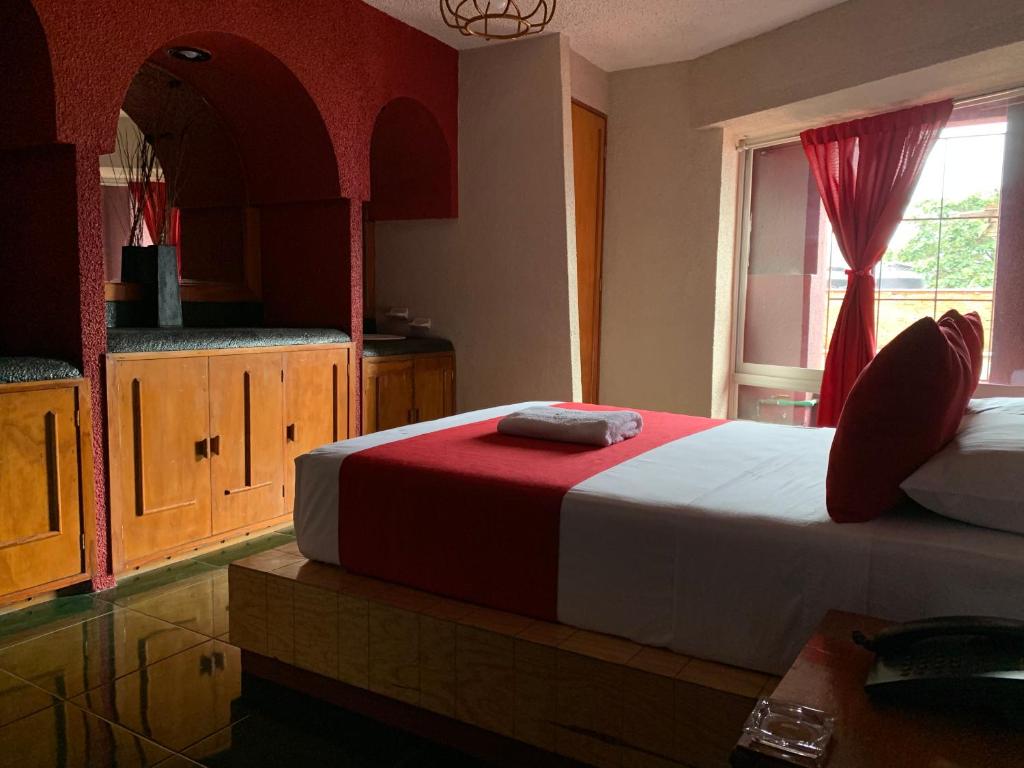 Postel nebo postele na pokoji v ubytování Hotel Alameda