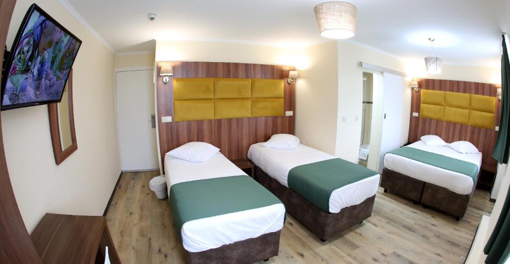 Postel nebo postele na pokoji v ubytování Sun Hotel