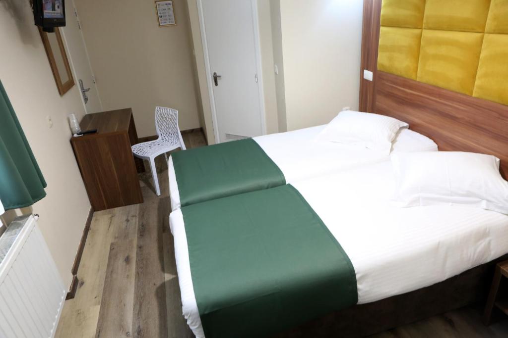 Postel nebo postele na pokoji v ubytování Sun Hotel