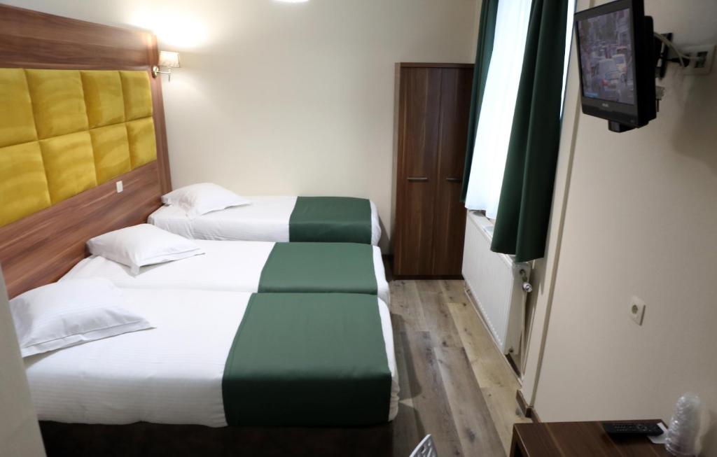 Postel nebo postele na pokoji v ubytování Sun Hotel
