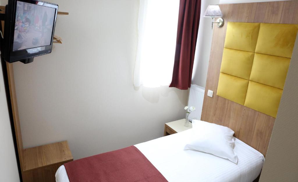 Postel nebo postele na pokoji v ubytování Sun Hotel